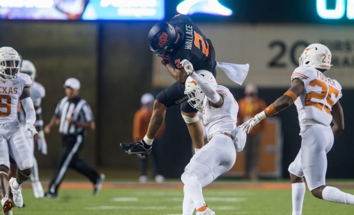 Wallace makes a senational catch druing the fourth quarter against Texas. Wallace finished with 11 receptions for 187-yards and two touchdowns.